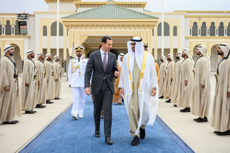 Sheikh Mohamed bin Zayed Al Nahyan, President of the United Arab Emirates, bids farewell to Bashar al-Assad, President of Syria, in Abu Dhabi