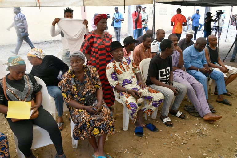 Voters wait to vote at a polling station for a gubernatorial and House of Assembly candidates during local elections, in Lagos