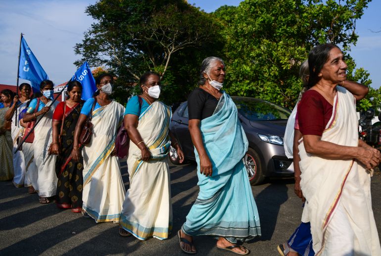 Pensioners walk in a procession as hundreds gather for an annual meeting in Piravom, Kerala