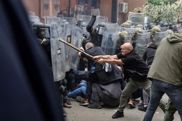 NATO Kosovo Force (KFOR) soldiers clash with local Kosovo Serb