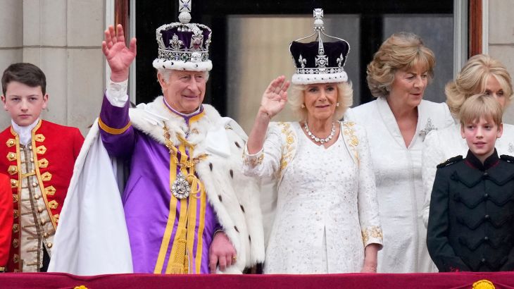 Britain's King Charles III and Queen Camilla wave to the crowds