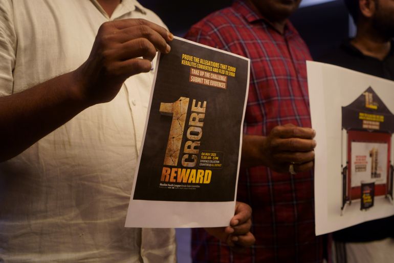 Muslim Youth League members holding a poster declaring the award