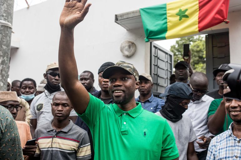 Opposition leader Ousmane Sonko waves to his supporters during a meeting in Ziguinchor on May 24, 2023