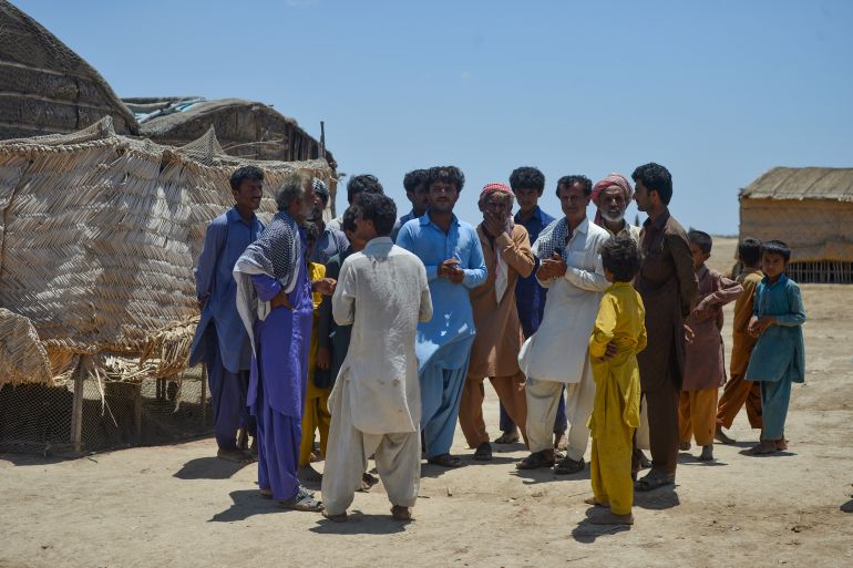 Villagers wait to be evacuated to government relief camps in Sujawal district of Pakistan’s Sindh province