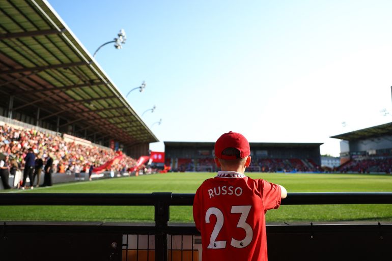A fan wearing an Alessia Russo jersey looks on before a match between Manchester United and Manchester City