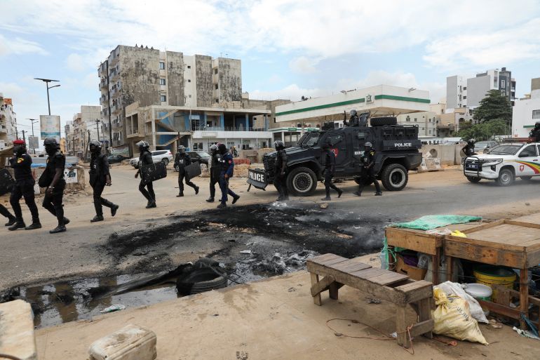 Gendarmes are deployed to calm protests after opposition leader Ousmane Sonko has been detained, in Dakar
