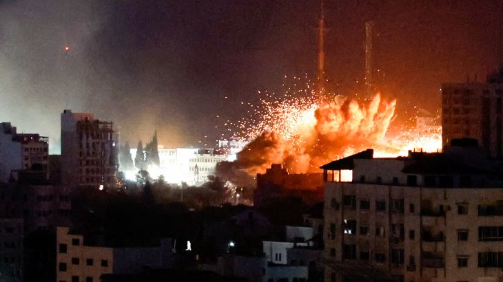 Flames and smoke billow during Israeli strikes in Gaza