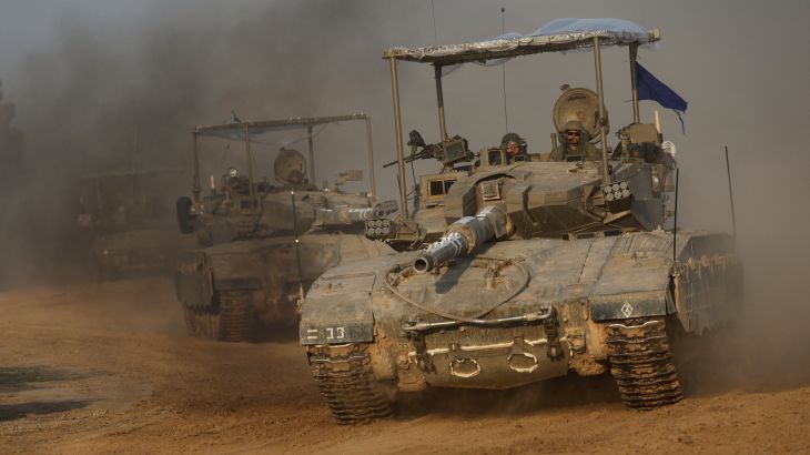 A convoy of Israeli tanks maneuvers near Israel's border with Gaza