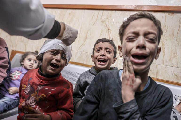 Injured people, including children, are brought to Al-Aqsa Martyrs Hospital for treatment after an Israeli attack following the humanitarian pause between Israel and Palestinian resistance group Hamas in Deir al-Balah, Gaza on December 02