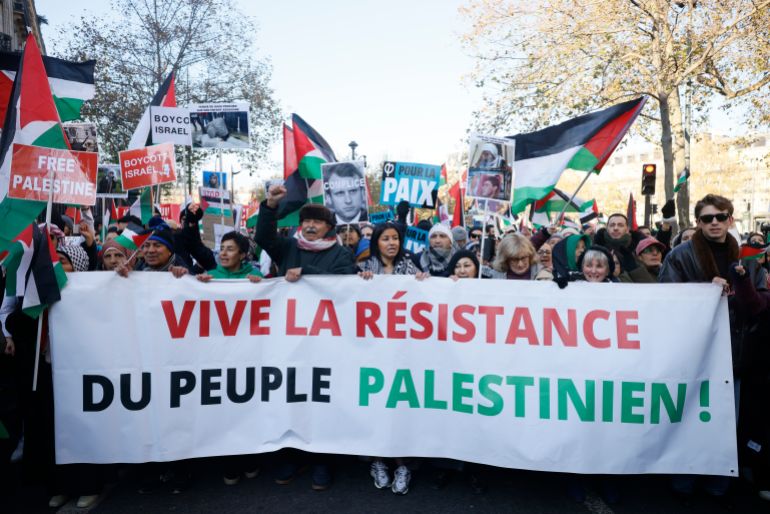 People chant slogans holding banners that reads « Long live the resistance of the Palestinian people" during a pro-Palestinian rally, in Paris, Saturday, Dec. 2