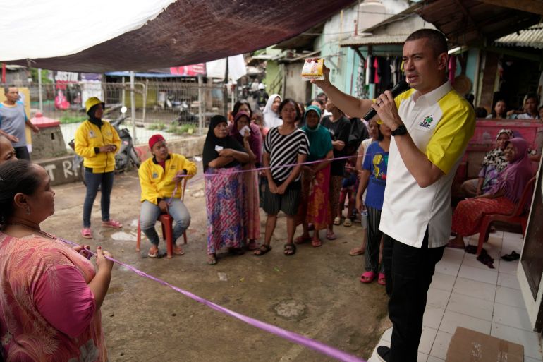 Rian Ernest makes his pitch to residents in a lower-income neighbourhood of Jakarta. He is opposed to vote buying