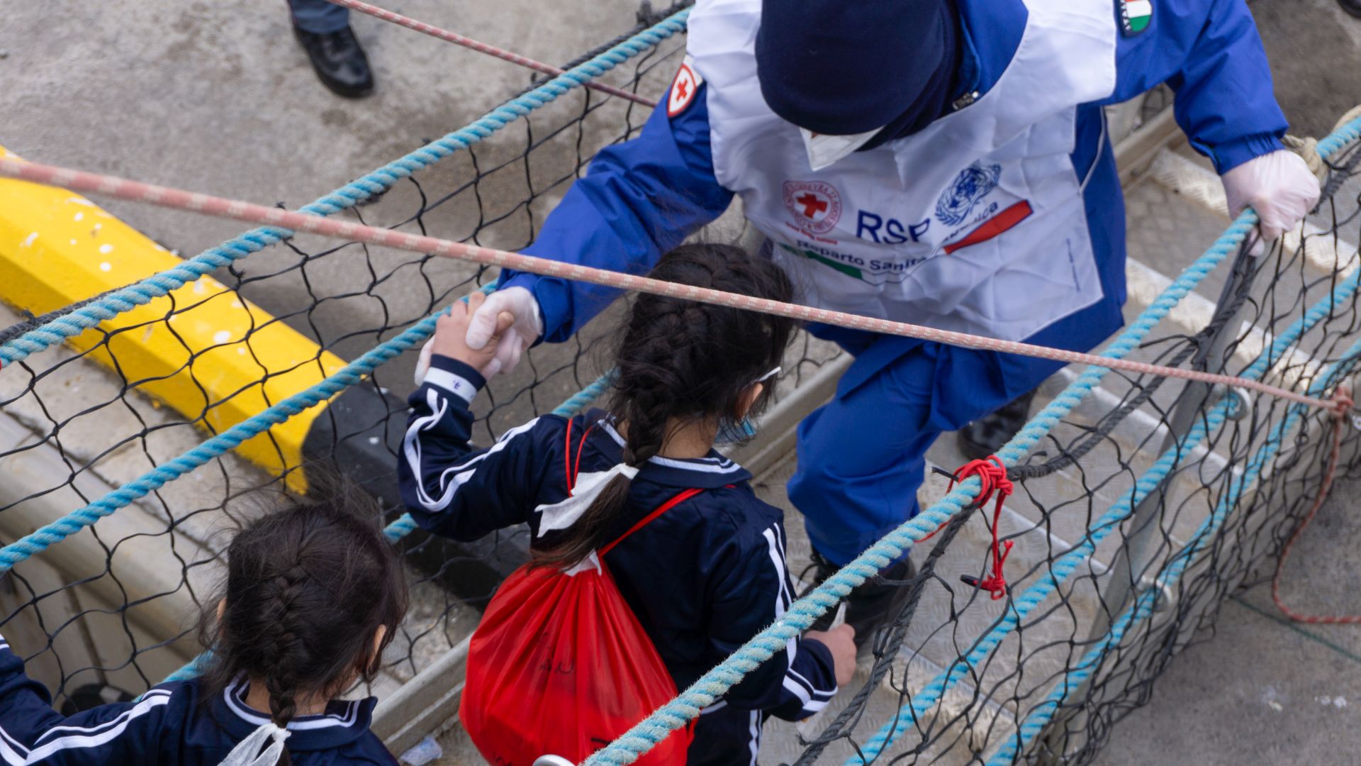Other children leaving the vessel. [Nora Adin Fares/Al Jazeera]