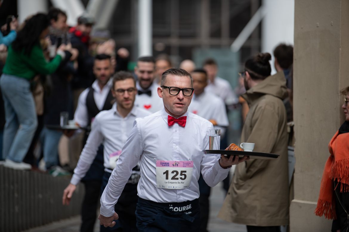 Racers were required to sport the white top and black bottoms traditionally worn by Parisian waiters.