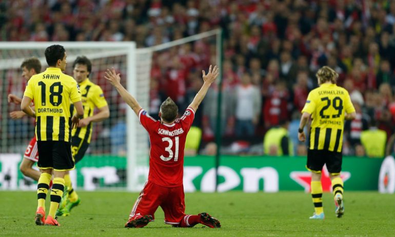 Bayern Munich's Bastian Schweinsteiger celebrates at the end of the match