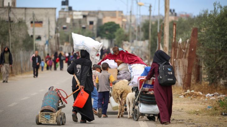 Displaced Palestinians in Rafah in the southern Gaza Strip carry their belongings as they leave following an evacuation order by the Israeli army on May 6, 2024, amid the ongoing conflict between Israel and the Palestinian Hamas movement