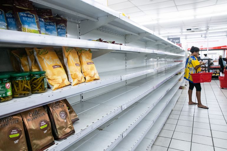 Empty shelves are seen at a supermarket in Noumea on May 16, 2024