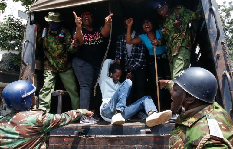 Detained protesters react inside a police truck during a demonstration against Kenya’s proposed finance bill in Nairobi, Kenya