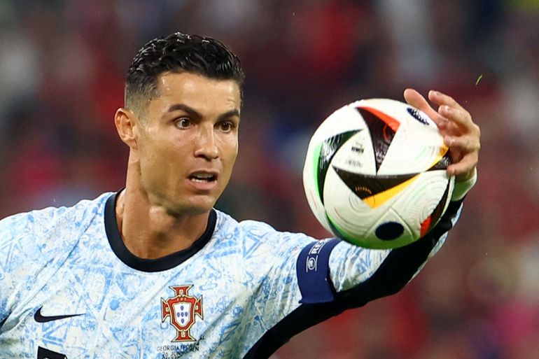 Football player handling ball.