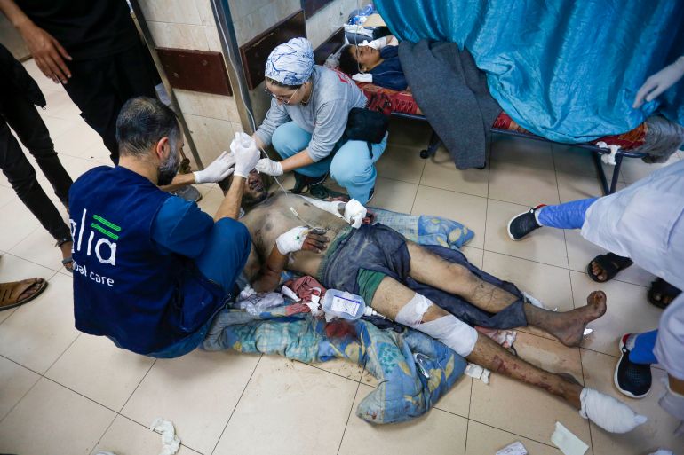 Palestinians injured in Israeli attack on Bureij refugee camp at Al-Aqsa Martyrs Hospital in Deir al-Balah, Gaza