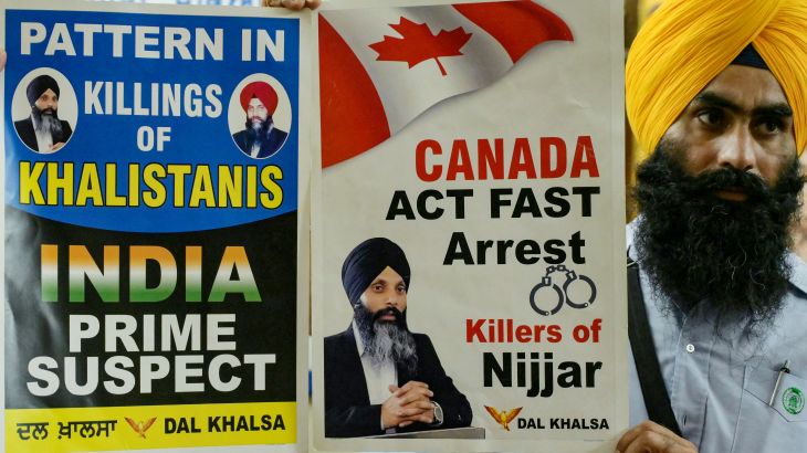 A member of a Sikh organisation holds a placard displaying Sikh separatist Hardeep Singh Nijjar in Amritsar on September 22, 2023. An activist for the creation of an independent Sikh homeland called Khalistan, Hardeep Singh Nijjar was wanted by Indian authorities for alleged terrorism and conspiracy to commit murder, and was shot dead by two masked assailants near Vancouver in June.