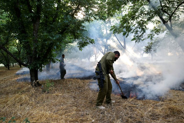 The Israeli first response unit put out flames after rockets were launched from Lebanon into northern Israel, close to the city of Kiryat Shmona, on June 4