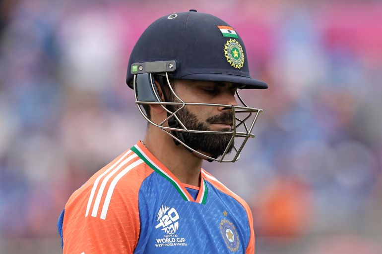 India's Virat Kohli reacts as he walks off the field after losing his wicket during the ICC Men's T20 World Cup cricket match between United States and India at the Nassau County International Cricket Stadium in Westbury, New York, Wednesday, June 12, 2024. (AP Photo/Adam Hunger)
