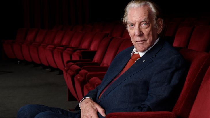 Donald Sutherland. He is seated in a chair and looks at ease.