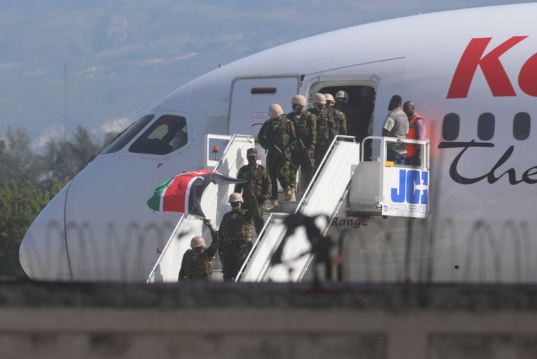 Police from Kenya deplane at the Toussaint Louverture International Airport in Port-au-Prince, Haiti, on Tuesday, June 25, 2024