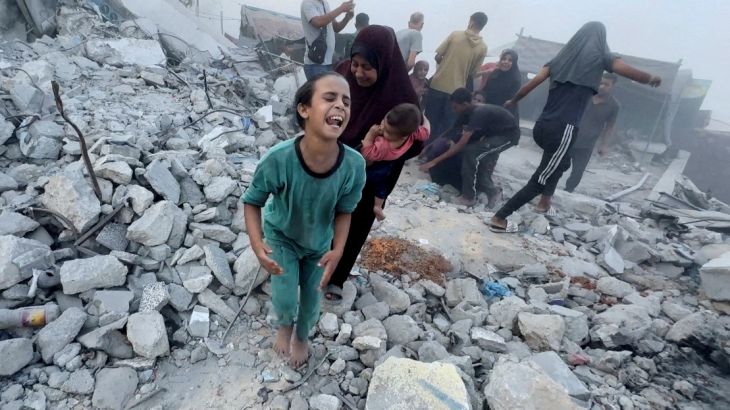 Palestinians react, following an Israeli strike near a UN-run school sheltering displaced people, amid the Israel-Hamas conflict, in Khan Younis, in the southern Gaza Strip, in this still image taken from a video, July 3, 2024. REUTERS/Mohammed Salem