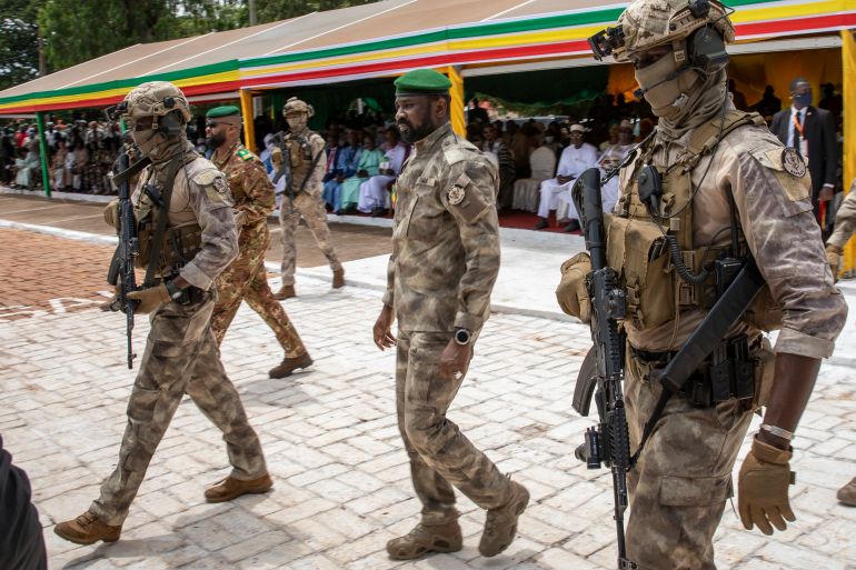The leader of Mali’s ruling military government Colonel Assimi Goita, centre, attends an independence day military parade in Bamako in September 2022