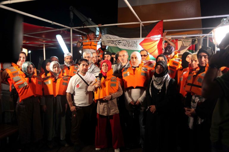 Pro-Palestinian activists from Turkey, wearing life jackets, hold a news conference on board the Mavi Marmara on May 30, 2010