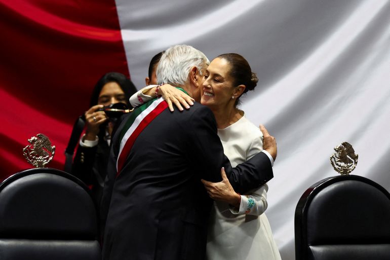 Former President Andres Manuel Lopez Obrador and President Claudia Sheinbaum embrace on the day of her swearing-in ceremony at the Congress, in Mexico City, Mexico, October 1, 2024