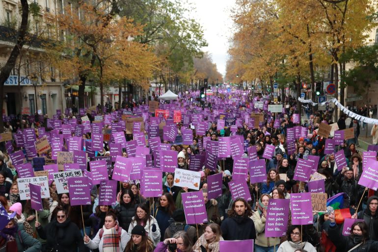 Demonstrators march against violence against women