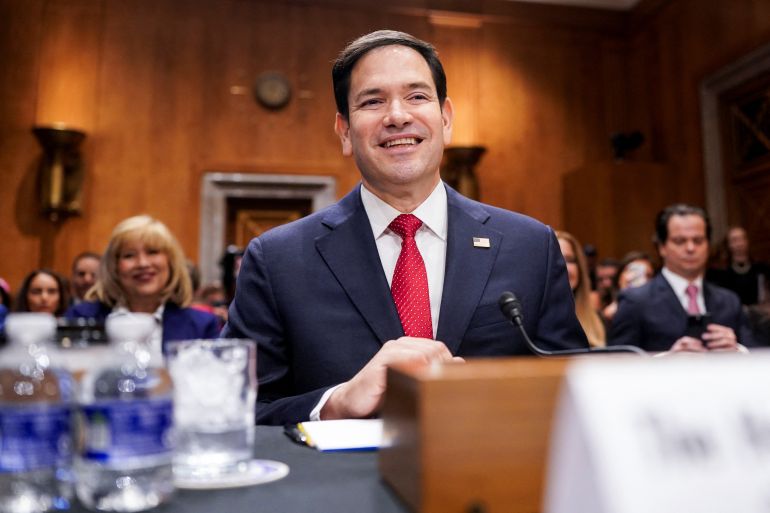 US Senator Marco Rubio sits at a desk during his Senate confirmation heraing