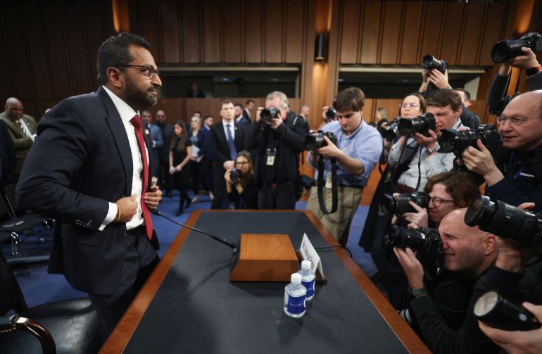 Patel faces the media at his hearing before the Senate Judiciary Committee