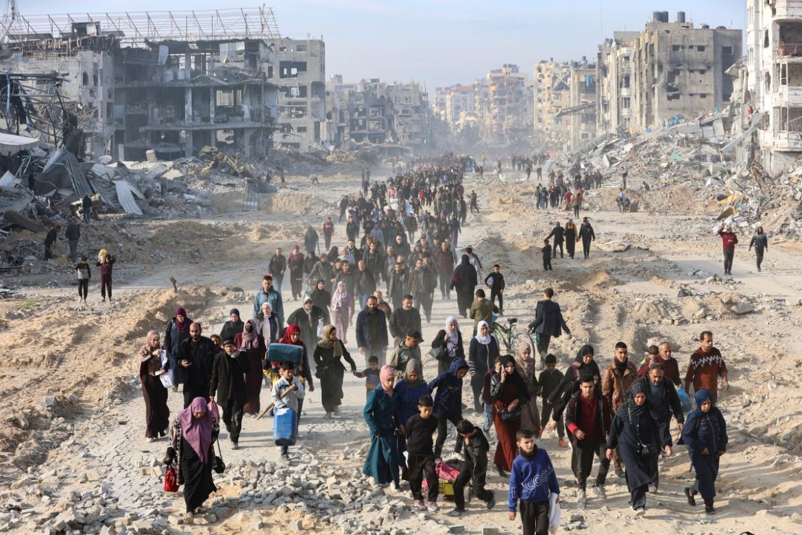 This aerial view shows displaced Palestinians returning to the war-devastated Jabalia refugee camp