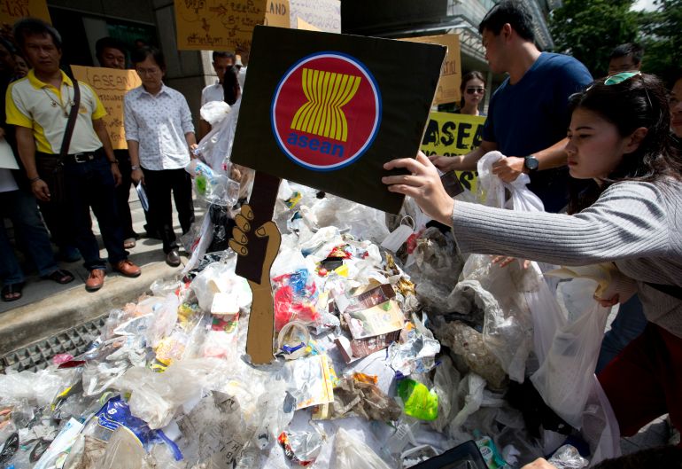 Thai activists put the logo ASEAN on plastic and electronic waste