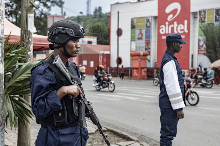 Congolese traffic police officers affiliated with the M23 fighters direct traffic on the roads around the Birere Market in Goma on February 17, 2025