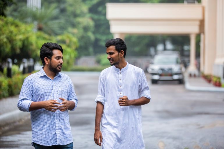 Nahid Islam, left, talks to Asif Mahmud, both student protest leaders and now ministers in Bangladesh's interim government, in Dhaka, Bangladesh, on Aug.11, 2024. (AP Photo/Rajib Dhar)