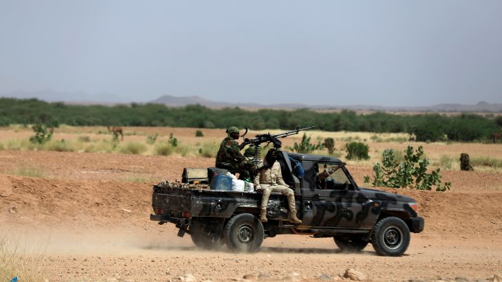 Nigerian army soldiers board a pickup to escort Nigerians heading north towards Libya as they leave Agadez, Niger October 29, 2019. Picture taken October 29, 2019. REUTERS/Zohra Bensemra