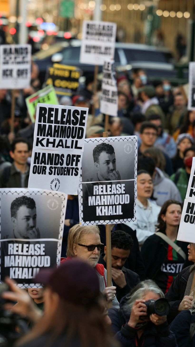 Protesters hold up signs calling for Mahmoud Khalil's release