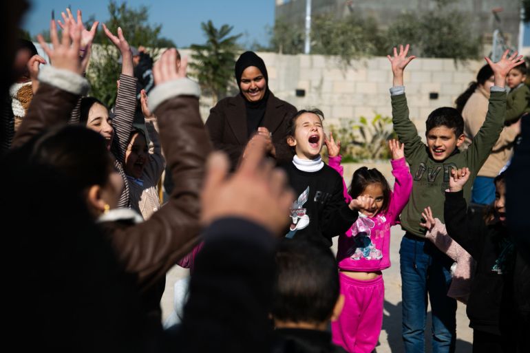 Children shout, jump, and scream during a Freedom Theater programme to allow them to discuss their trauma and give them a space for play and laughter [Al Jazeera]