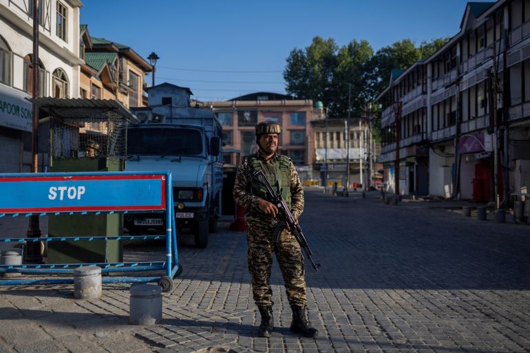 An Indian security force personnel stands guard on a street, following an attack on tourists near Pahalgam in south Kashmir, in Srinagar, April 29, 2025.