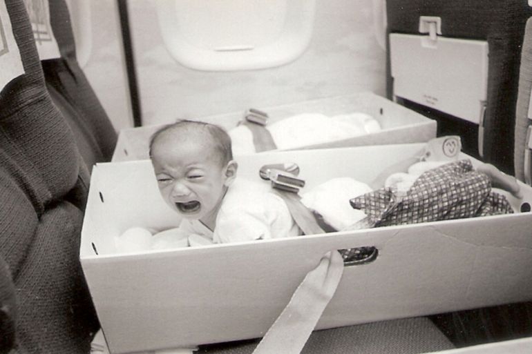 Babies were placed into filing boxes with seatbelts looped through the carry-holes [Courtesy of Frederick Burkle]