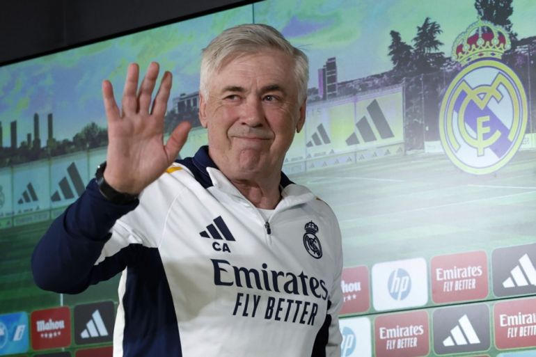 Real Madrid's head coach Carlo Ancelotti waves.