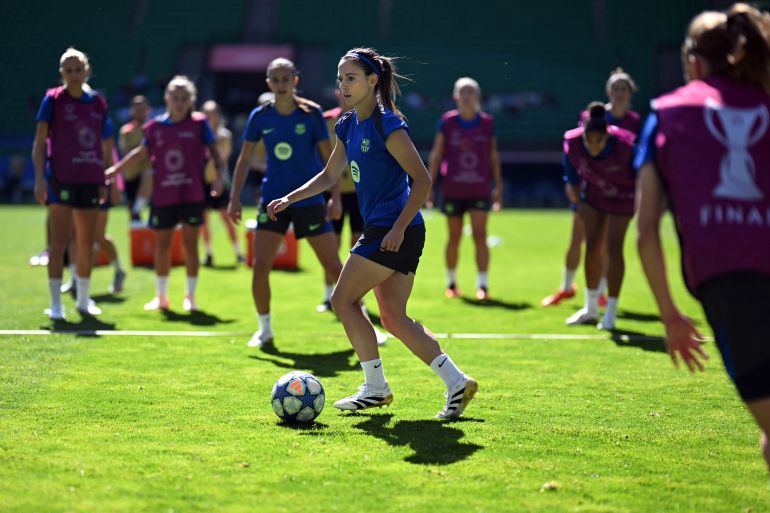 Barcelona's Spanish midfielder #14 Aitana Bonmati (C) attends a training session on the eve of the UEFA Women's Champions League final football match between Arsena