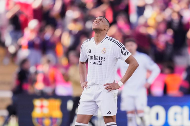 Real Madrid's Kylian Mbappe reacts during the Spanish La Liga soccer match between Barcelona and Real Madrid at the Lluis Companys Olympic Stadium in Barcelona, Spain, Sunday, May 11, 2025. (AP Photo/Jose Breton)