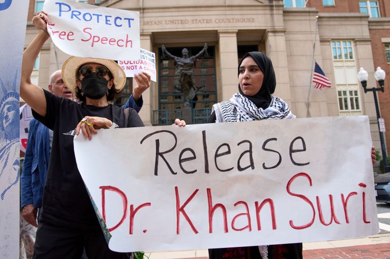 Mapheze Saleh, right, wife of arrested and detained Georgetown University scholar Badar Khan Suri, holds a sign calling for her husband’s release after speaking at a news conference following his hearing at Federal District Court for the Eastern District of Virginia, on May 1, 2025 [Jacquelyn Martin, AP Photo]