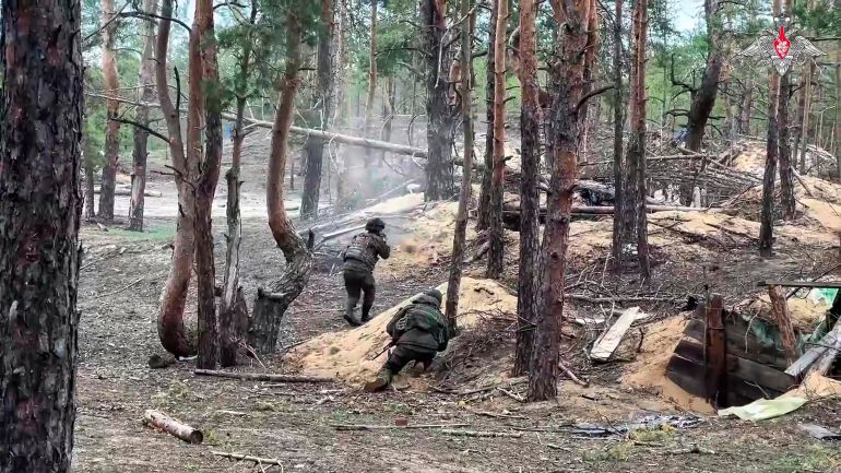In this photo taken from video distributed by Russian Defense Ministry Press Service on Wednesday, May 21, 2025, Russian servicemen attend a combat training for assault units in an undisclosed location in Ukraine. (Russian Defense Ministry Press Service via AP)