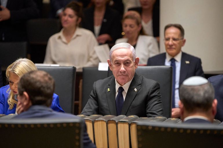 Israel's Prime Minister Benjamin Netanyahu arrives to meet with family members of the Israeli hostage Evyatar David, a hostage held captive in the Gaza Strip by Palestinian militants since the October 2023 attacks, during the opening ceremony of the Knesset Museum in Jerusalem on August 11, 2025. (Photo by Ohad Zwigenberg / POOL / AFP)